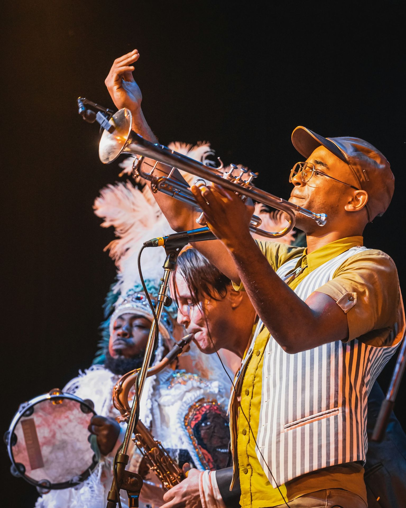 A group of men playing musical instruments on stage